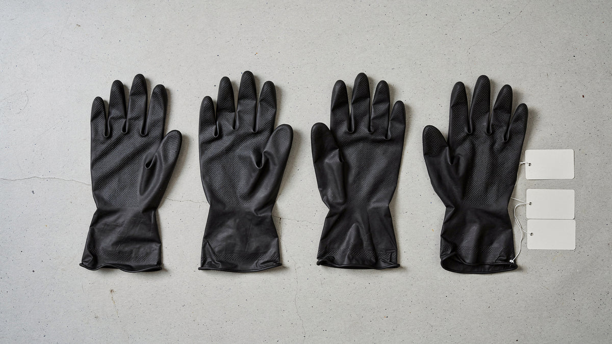 Nitrile gloves in four thicknesses laid side by side